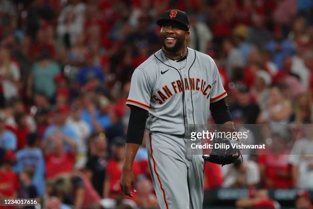 Jay Jackson of the San Francisco Giants returns to the dugout after recording a bases-loaded third out against the St. Louis Cardinals in the sixth...