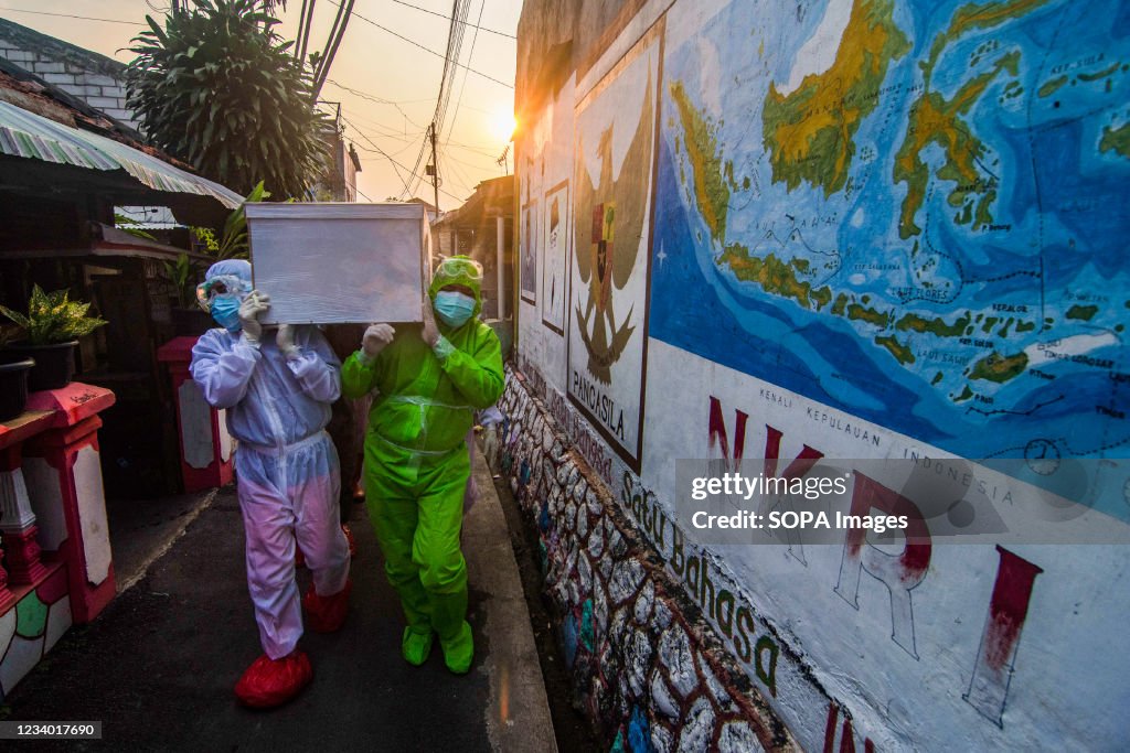 (EDITORS NOTE: Image depicts death)
Health workers wearing...