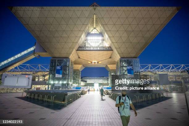 July 2021, Japan, Tokio: A man leaves the press center "Main-Press-Center" in Tokyo Big Sight. The Summer Olympics are scheduled to be held in Tokyo...