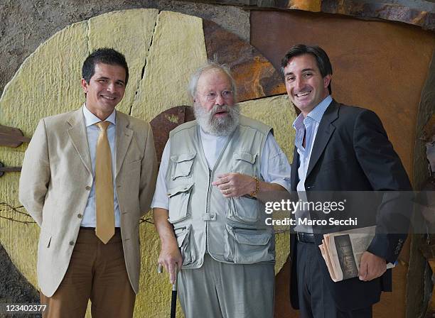 Swiss artist Pierre Case poses for pictures with Derek Donadini and Filippo Perissinotto of Scuola della Misericordia ahead of the opening of the...
