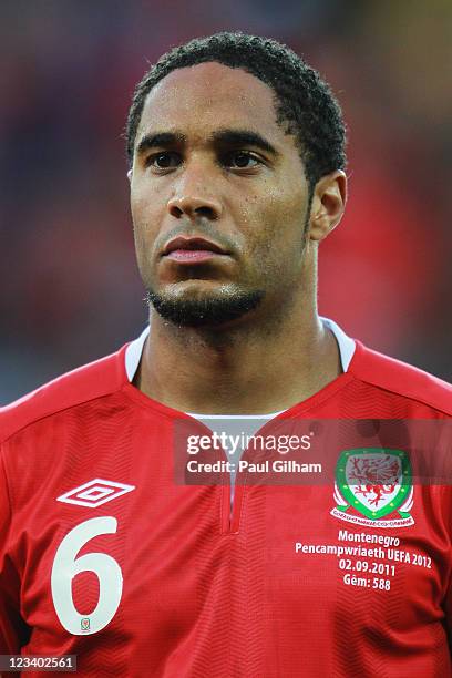 Ashley Williams of Wales lines up for the national anthems before the UEFA EURO 2012 group G qualifying match between Wales and Montenegro at the...