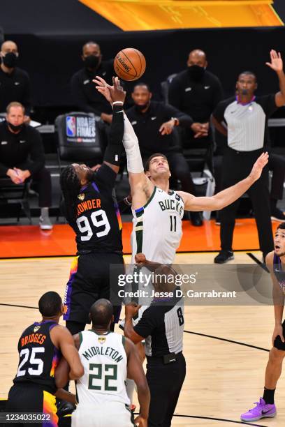 Jump-ball between Jae Crowder of the Phoenix Suns and Brook Lopez of the Milwaukee Bucks during Game Five of the 2021 NBA Finals on July 17, 2021 at...