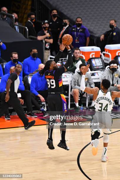 Jae Crowder of the Phoenix Suns shoots a three-pointer against the Milwaukee Bucks during Game Five of the 2021 NBA Finals on July 17, 2021 at...