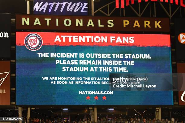 Sign on scoreboard after what is believed to be shots were heard outside the stadium during a baseball game between the San Diego Padres and the...