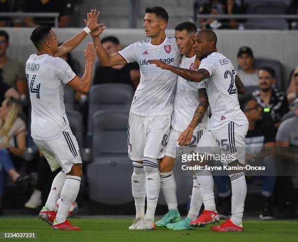 Rubio Rubin, Damir Kreilach, Aaron Herrera and Everton Luiz of Real Salt Lake high five after a goal the first half of the game against Los Angeles...