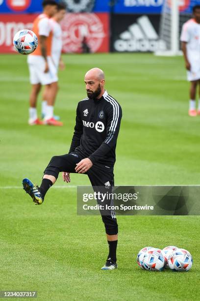 Defensive coach Laurent Ciman plays with a ball at warm-up before the FC Cincinnati versus the CF Montreal game on July 17 at Stade Saputo in...