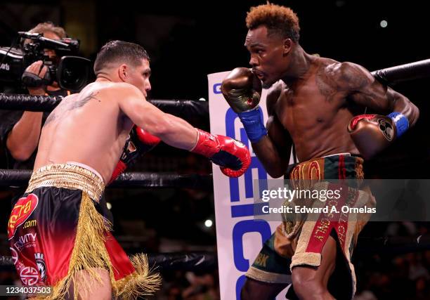 Jermell Charlo and Brian Castano exchange punches during their Super Welterweight fight at AT&T Center on July 17, 2021 in San Antonio, Texas. The...