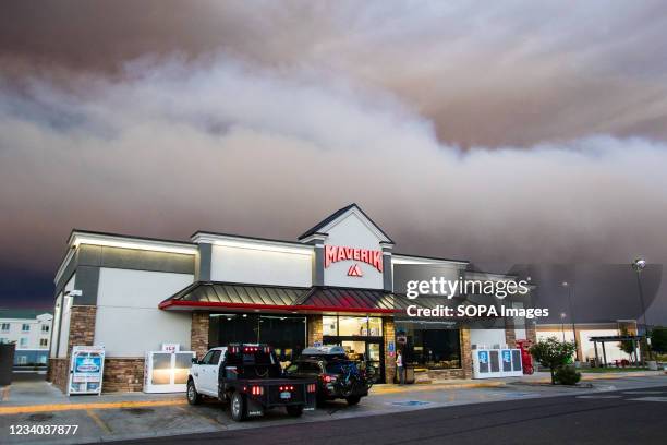Smoke from the Tamarack fire seen over a gas station. The Tamarack fire has rapidly gained size and continued to burn through the night, over 6500...