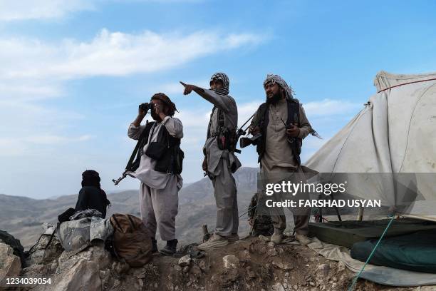 In this picture taken on July 15 Afghan militia fighters keep a watch at an outpost against Taliban insurgents at Charkint district in Balkh Province.