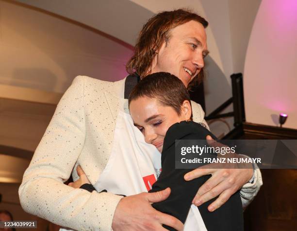 German actor Lars Eidinger and Austrian actress Verena Altenberger hug during the party after the premiere of "Jedermann" by Austrian novelist,...