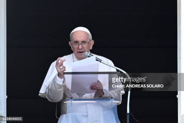 Pope Francis delivers the Sunday Angelus prayer from the window of his study overlooking St. Peter' Square at the Vatican on July 18, 2021. - Pope...