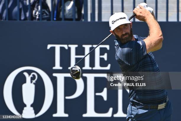 Golfer Dustin Johnson plays his shot from the 1st tee during his final round on day 4 of The 149th British Open Golf Championship at Royal St...