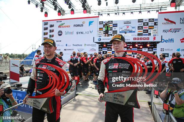 Kalle Rovanpera of Finland and Jonne Halttunen of Finland celebrate their victory on the final podium in Tartu during Day Three of the FIA World...