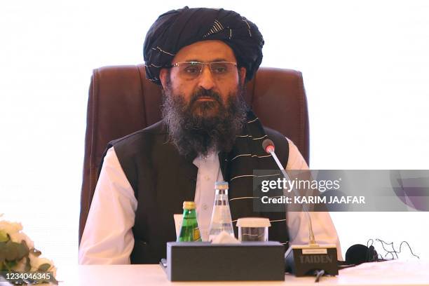 The leader of the Taliban negotiating team Mullah Abdul Ghani Baradar looks on during the final declaration of the peace talks between the Afghan...