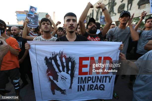 Demonstrators holding banners gather to protest against the corruption and violation of human rights, demanding to punish murders in the country in...