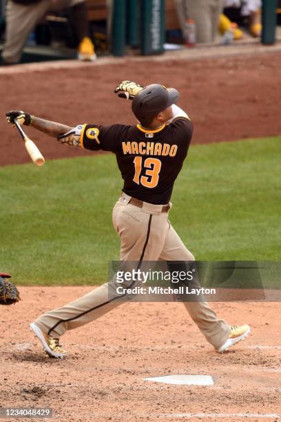 Manny Machado of the San Diego Padres hits a two-run home run in the eighth inning during a baseball game against the Washington Nationals at...