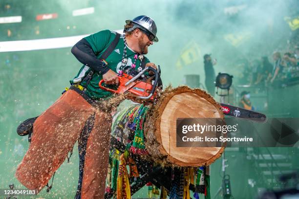 Portland Timbers mascot Timber Joey cuts a slab to celebrate Jeremy Ebobisse goal during an MLS match between the Portland Timbers and FC Dallas on...