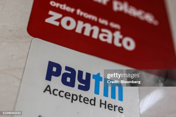 Store advertises the use of the Paytm digital payment system and the Zomato Ltd. Food delivery app in Mumbai, India, on Saturday, July 17, 2021....