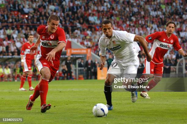 Luis Fabiano of Sevilla and Franck Queudrue of Middlesbrough compete for the ball during the UEFA Cup final match between Middlesbrough and Sevilla...