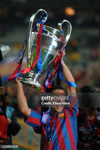 Ronaldinho of Barcelona celebrates with the trophy after the award ceremony following the UEFA Champions League final match between Barcelona and...