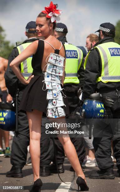 Glamorous protester wears a freedom dress in Whitehall as part of anti lockdown protest on July 19, 2021 in London, England. Anti-lockdown protests...
