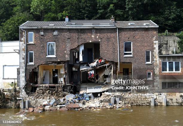 This picture taken in Pepinster, near Liege, on July 19 shows a destroyed building after heavy rains and flooding across areas of France, Belgium,...
