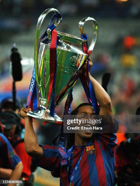 Ronaldinho of Barcelona celebrates with the trophy after the award ceremony following the UEFA Champions League final match between Barcelona and...