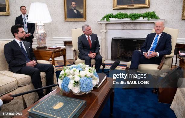 President Joe Biden and Jordan's King Abdullah II, alongside Jordan's Crown Prince Hussein bin Abdullah II , hold a meeting in the Oval Office of the...