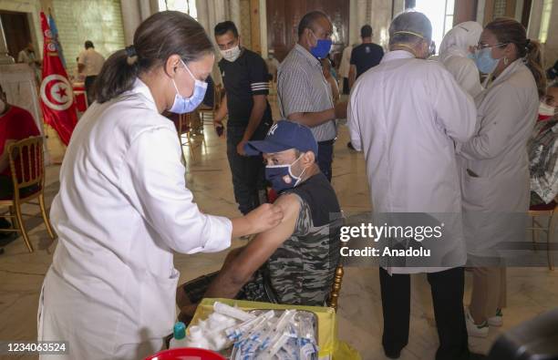 Municipal employees receive Sputnik V vaccine against Covid-19 pandemic in Tunis, Tunisia on July 19, 2021.