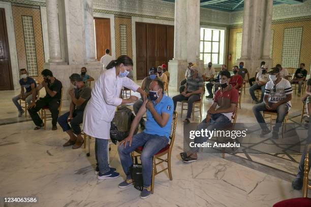 Municipal employees receive Sputnik V vaccine against Covid-19 pandemic in Tunis, Tunisia on July 19, 2021.