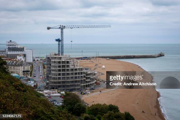 Construction cranes working on Folkestone seafront development on the 15th of July 2021, in Folkestone, United Kingdom. The development consisting of...