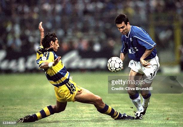 Diego Fuser of Parma lunges but cannot stop Tony Vidmar of Rangers during the Champions'' League, Third Round, Second Leg match between Parma and...