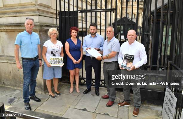 Leader Colum Eastwood and shadow Northern Ireland secretary Louise Haigh with a delegation of families bereaved during the Northern Ireland Troubles...