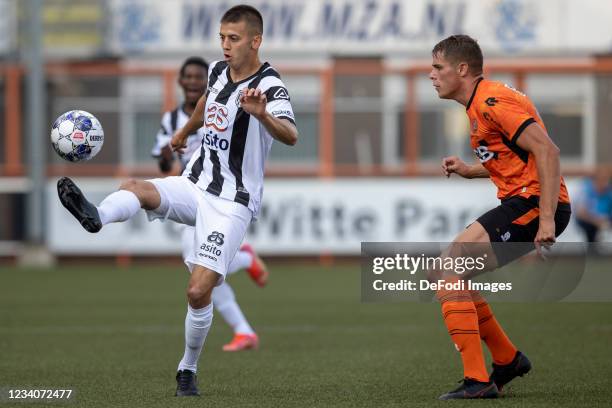 Adrian Szoke of Heracles Almelo battle for the ball during the Pre-Season Friendly match between FC Volendam and Heracles Almelo at Kras Stadion on...