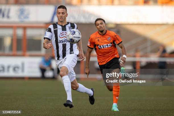 Adrian Szoke of Heracles Almelo battle for the ball during the Pre-Season Friendly match between FC Volendam and Heracles Almelo at Kras Stadion on...