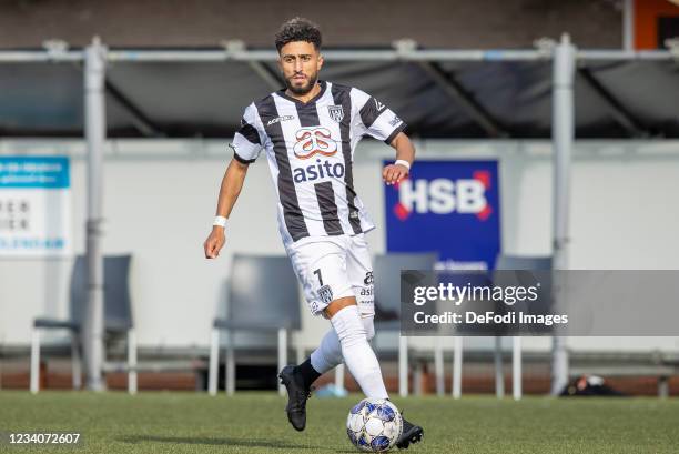 Bilal Basacikoglu of Heracles Almelo controls the ball during the Pre-Season Friendly match between FC Volendam and Heracles Almelo at Kras Stadion...