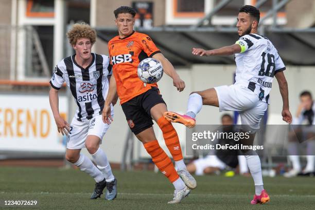 Bram Marsman of Heracles Almelo, Jordi Blom of Volendam and Ismail Azzaoui of Heracles Almelo battle for the ball during the Pre-Season Friendly...