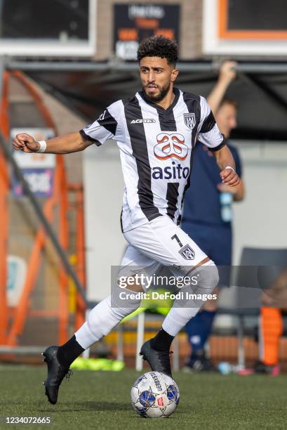 Bilal Basacikoglu of Heracles Almelo controls the ball during the Pre-Season Friendly match between FC Volendam and Heracles Almelo at Kras Stadion...
