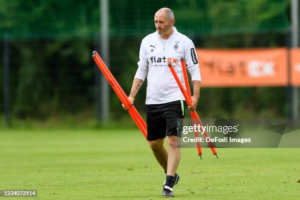 Assistant coach Oliver Neuville of Borussia Moenchengladbach looks on during the Training Camp at Klosterpforte on July 19, 2021 in Marienfeld,...