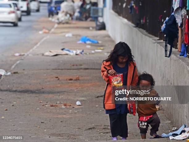 Indigenous children are seen during a demonstration outside the Indigenous National Institute in demand of basic assistance for the community, a...