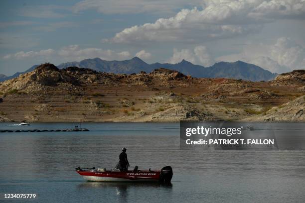 Visitor launches a boat near the Lake Mead Marina as a "bathtub ring" is visible during low water levels due to the western drought on July 19, 2021...