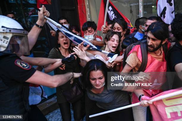 Protesters clash with police officers during a rally, in the Kadikoy district, in Istanbul, on July 20 called to mark on the anniversary of the 2015...