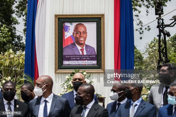 Officials attend a ceremony in honor of late Haitian President Jovenel Moise at the National Pantheon Museum in Port-au-Prince, Haiti, on July 20,...