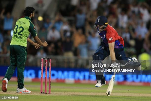 England's David Willey completes the final run during the third T20 international cricket match between England and Pakistan at Old Trafford Cricket...