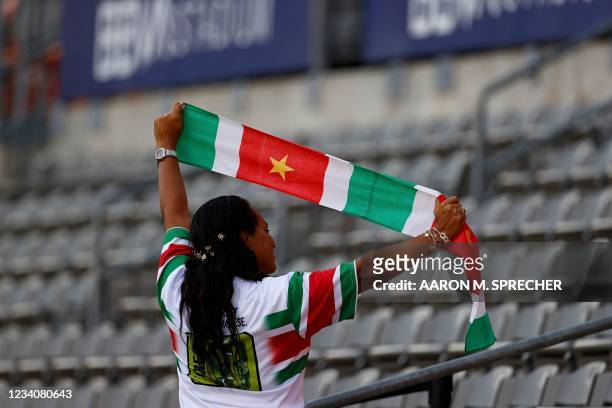 Suriname fan supports her team during the CONCACAF Gold Cup Prelims football match between Suriname and Guadeloupe on July 20, 2021 at BBVA Stadium...