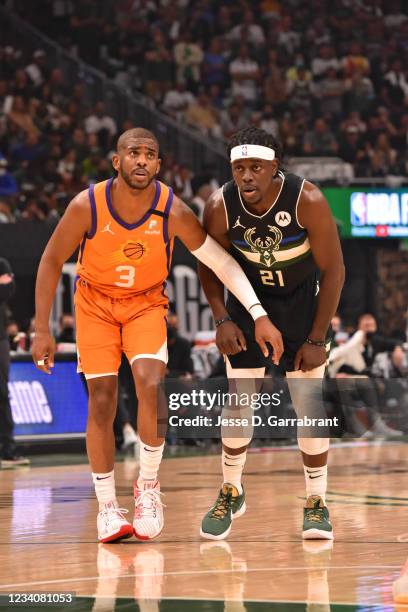 Chris Paul of the Phoenix Suns and Jrue Holiday of the Milwaukee Bucks look on during Game Six of the 2021 NBA Finals on July 20, 2021 at Fiserv...