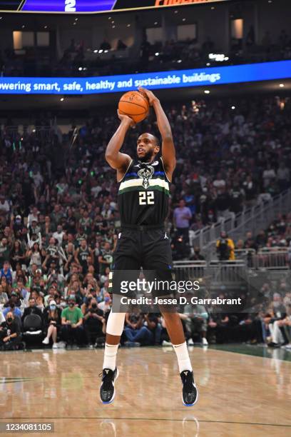 Khris Middleton of the Milwaukee Bucks shoots a three-pointer against the Phoenix Suns during Game Six of the 2021 NBA Finals on July 20, 2021 at...