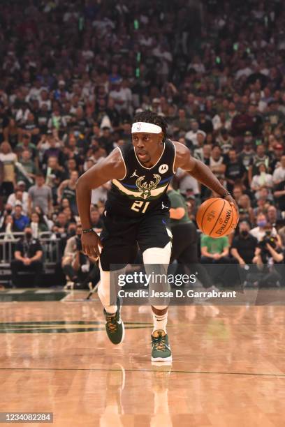 Jrue Holiday of the Milwaukee Bucks handles the ball against the Phoenix Suns during Game Six of the 2021 NBA Finals on July 20, 2021 at Fiserv Forum...