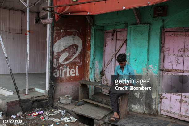 Bharti Airtel Ltd. Advert outside a store closed due to lockdown restrictions in Jalgaon, Maharashtra, India, on Monday, July 19, 2021. More than...