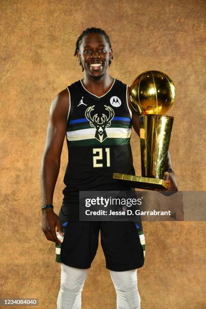 Jrue Holiday of the Milwaukee Bucks poses for a portrait with the Larry O'Brien Trophy after winning Game Six of the 2021 NBA Finals against the...